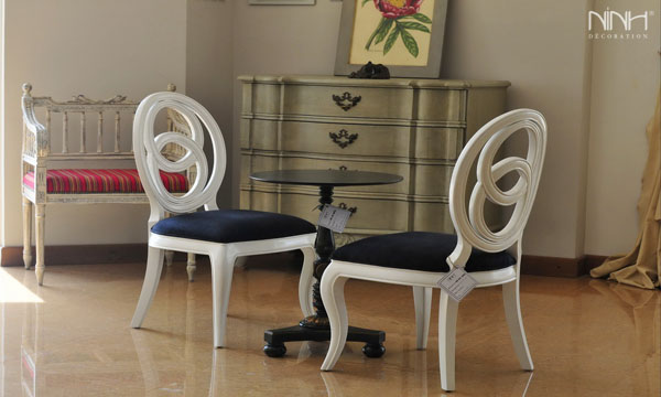 White chairs and table in dinning room