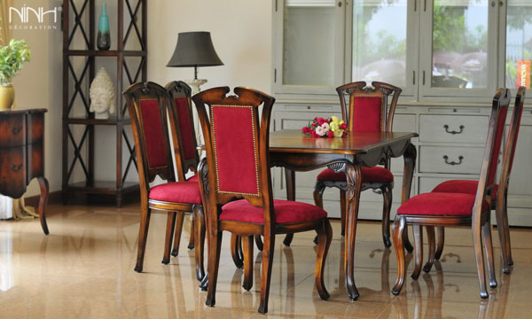 Table and chairs with red upholstery