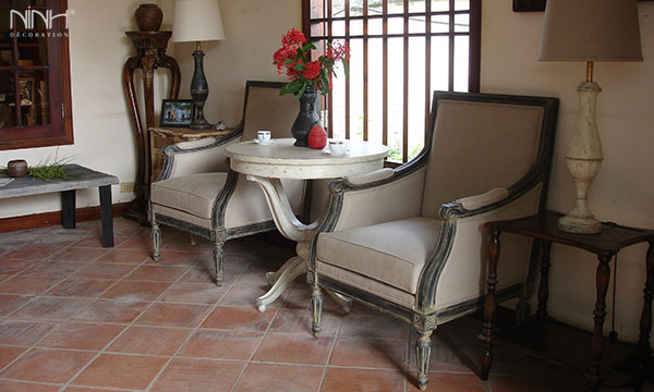 Grey sofas and white round cofee table