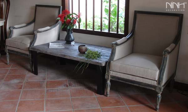 Two grey arm chair and coffee table